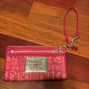 Pink Coach brand poppy wristlet